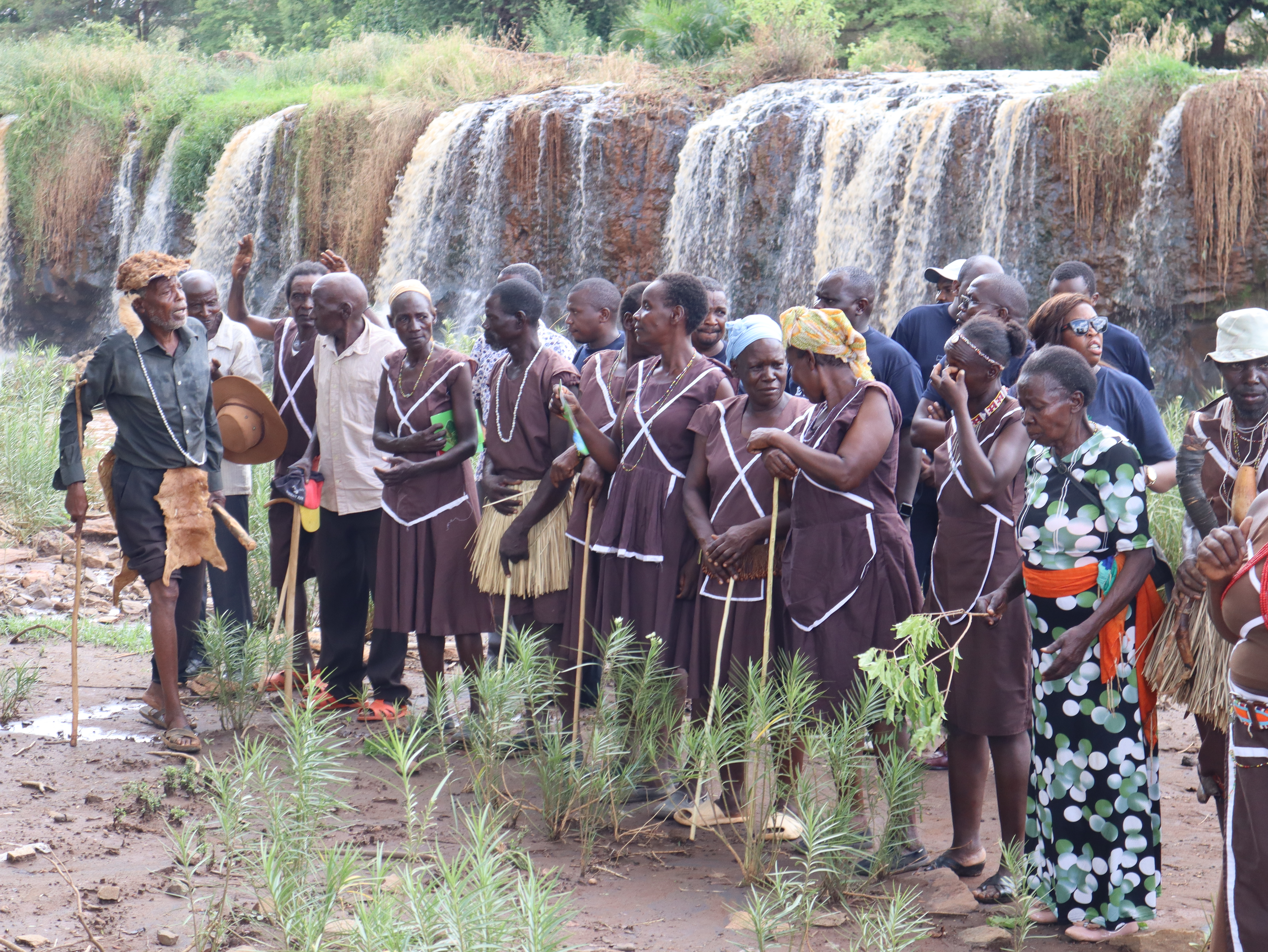 Tharaka Elders perform a rain prayer ritual at Kibuuka Sacred site, along Kathita River. 
