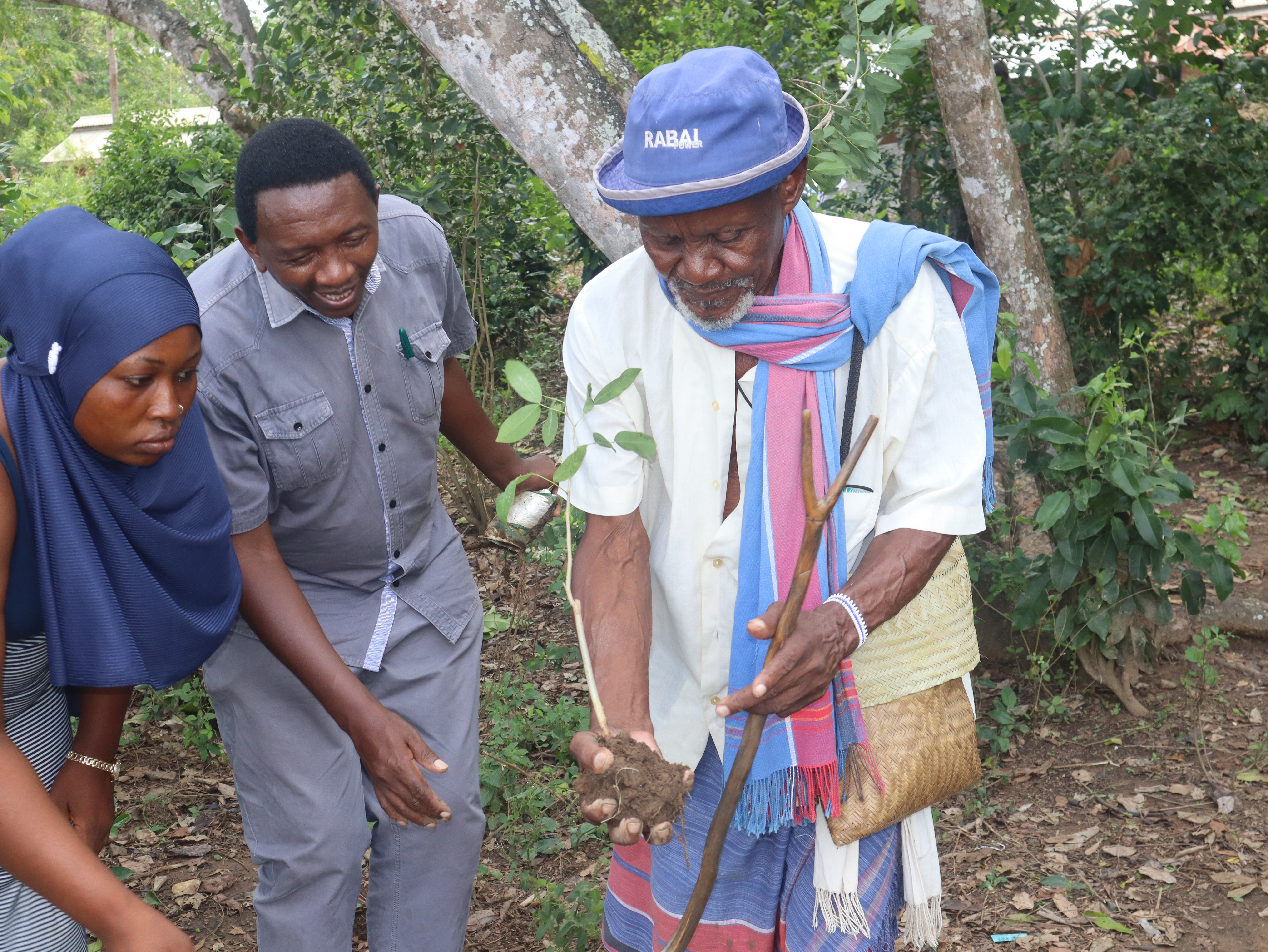 A Kaya Elder plants a seed of hope in Kaya Rabai, Kilifi County.